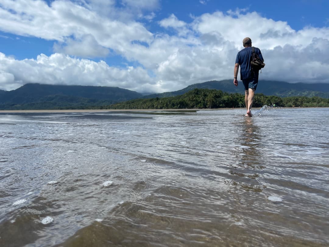 Alan walking alone on the beach — the turning point